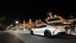 ferrari gto in a yacht club at night