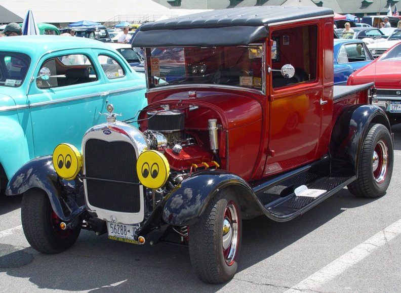 1929_ford_coupe_with_moon_eyes_lens_covers.jpg