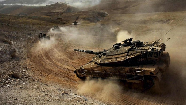 column_of_israeli_merkava_tanks_in_the_desert.jpg