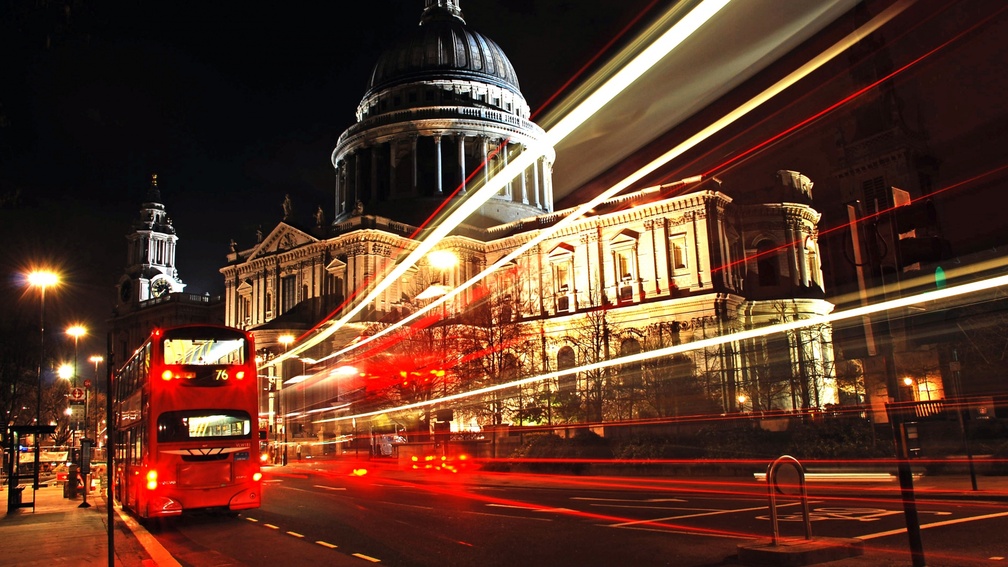 london bus at night in long exposure