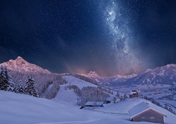 wonderful starry night above a town in a valley