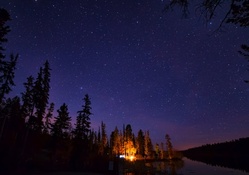 campfire under gorgeous stars at roche lake canada