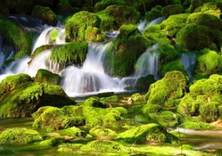 Waterfall on mossy rocks
