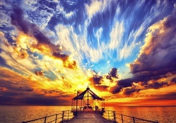amazing colorful sunset over sea pier hdr
