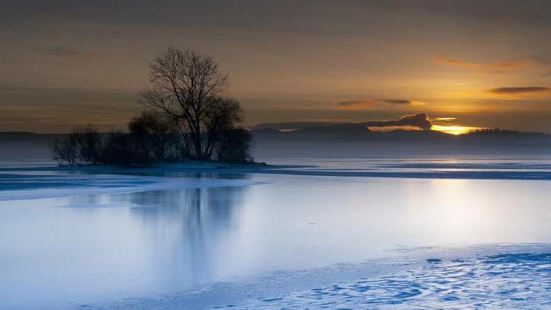 sunset on a peaceful winter lake