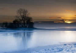 sunset on a peaceful winter lake