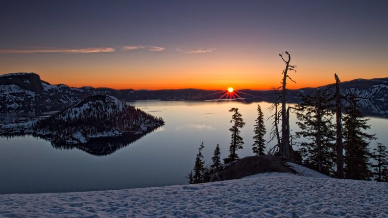 sunset over crater lake in winter