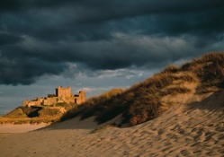 old castle on a sea coast under stormy sky