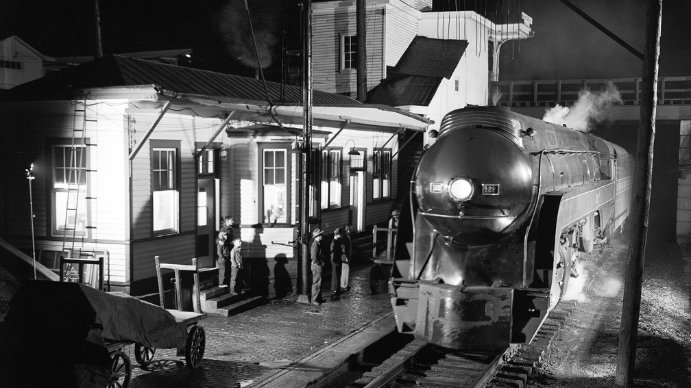 retro steam train at a station