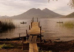 rickety pier on a lake in guatemala