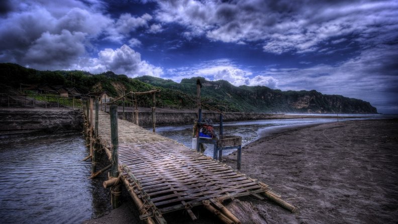 bamboo bridge over sea estuary hdr