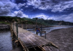 bamboo bridge over sea estuary hdr