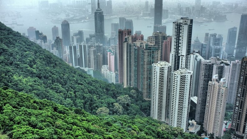 hong_kong_skyscrapers_by_a_forested_mountain_hdr.jpg