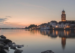 church tower in a coastal city at sunset