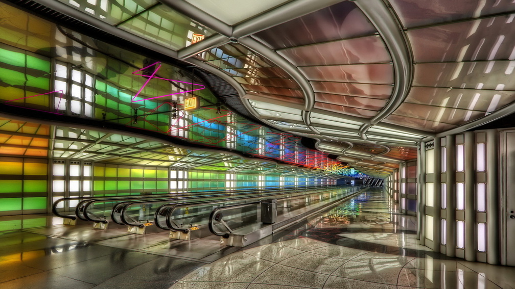 banks of modern airport escalators hdr