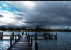 docks on a lake under stormy sky