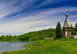wooden church by a river