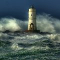amazing lighthouse in ocean waves