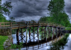pretty wooden bridge in a park hdr