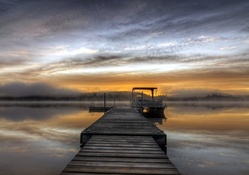 boat docks on a lake in morning