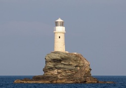 lighthouse on an island rock