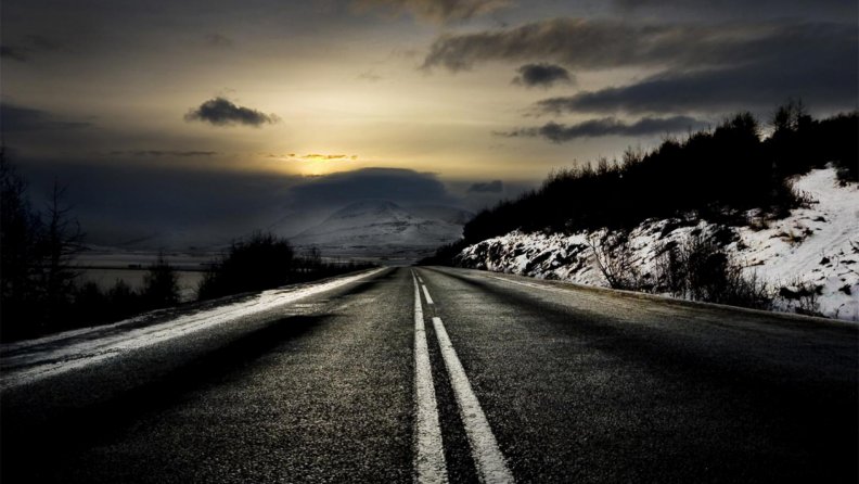 blacktop_road_on_a_dreary_sunset.jpg