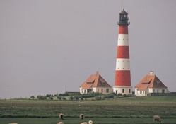 tall lighthouse in a french countryside