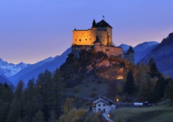 tarasp castle in switzerland at dusk
