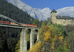train bridge to a castle in austrian alps