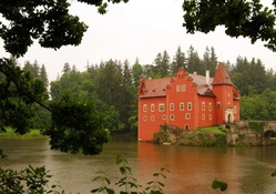 beautiful castle on a lake in rain