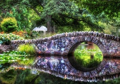 wonderful stone bridge in a park hdr