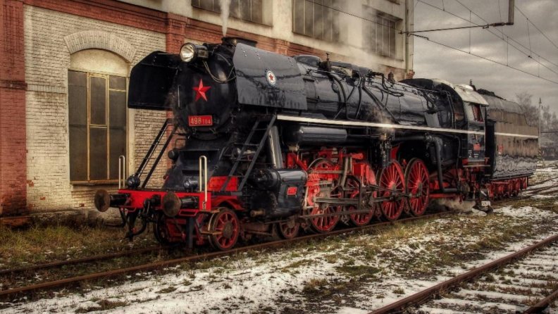 vintage steam locomotive in rail yard hdr