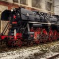 vintage steam locomotive in rail yard hdr