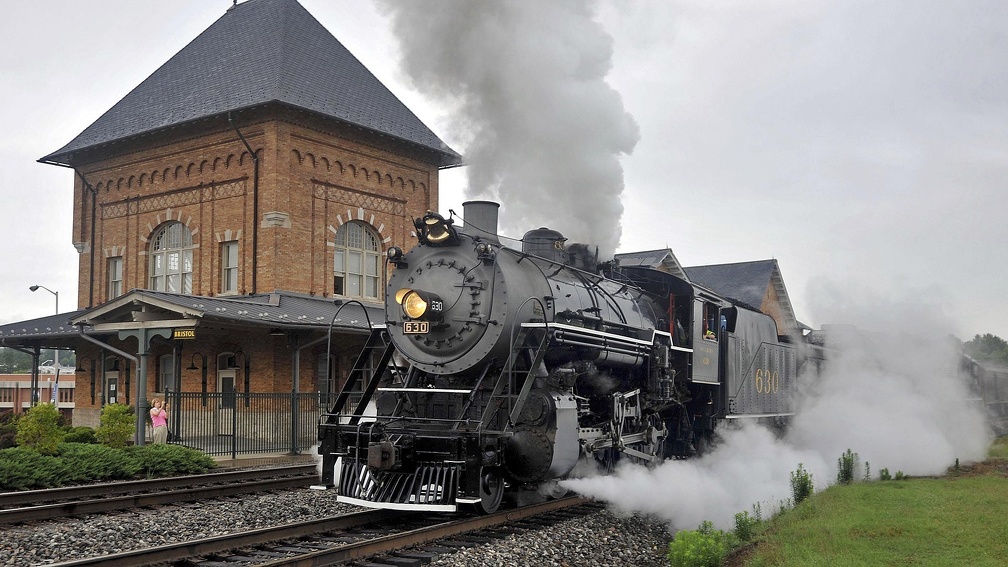 wonderful steam locomotive leaving a station