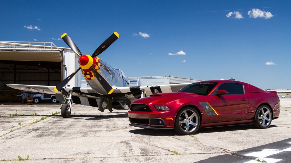 p51 and ford mustangs on the tarmac