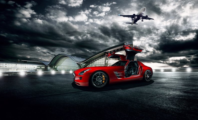 red_mercedes_sls_parked_in_an_airport.jpg