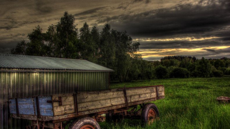 field wagon by a tin shed hdr