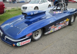 Blue Corvette on the raceway