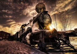 fantastic steam train in winter's sunset hdr