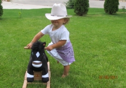 Cowgirl And Her Stuffed Horse