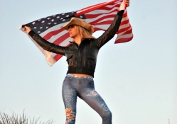 Cowgirl holding American Flag