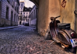 old plaggio scooter in side street in italy hdr