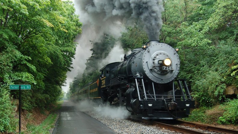 vintage steam train through a maryland forest