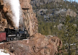 steam train on a narrow mountain track
