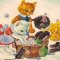 Three little kittens learning to wash clothes 
