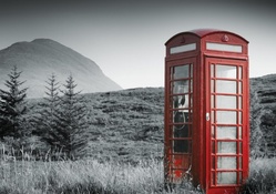 red phone booth in the middle of nowhere