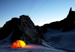 camping in tent on mountain in winter