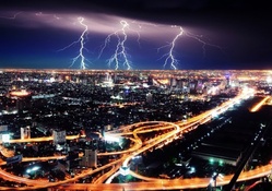 lightning storm over a city at night