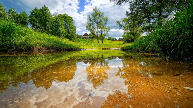 beautiful_clear_stream_by_a_village_hdr.jpg