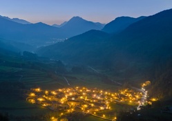 dawn over a village in a valley